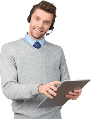 Man wearing a headset and holding a tablet, smiling.