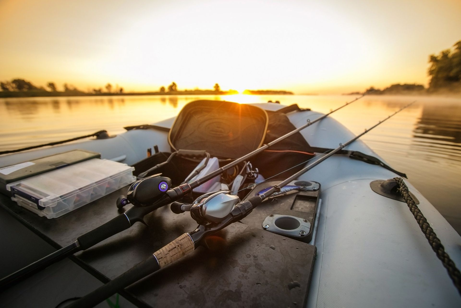 Fishing rods are sitting on the deck of a boat.