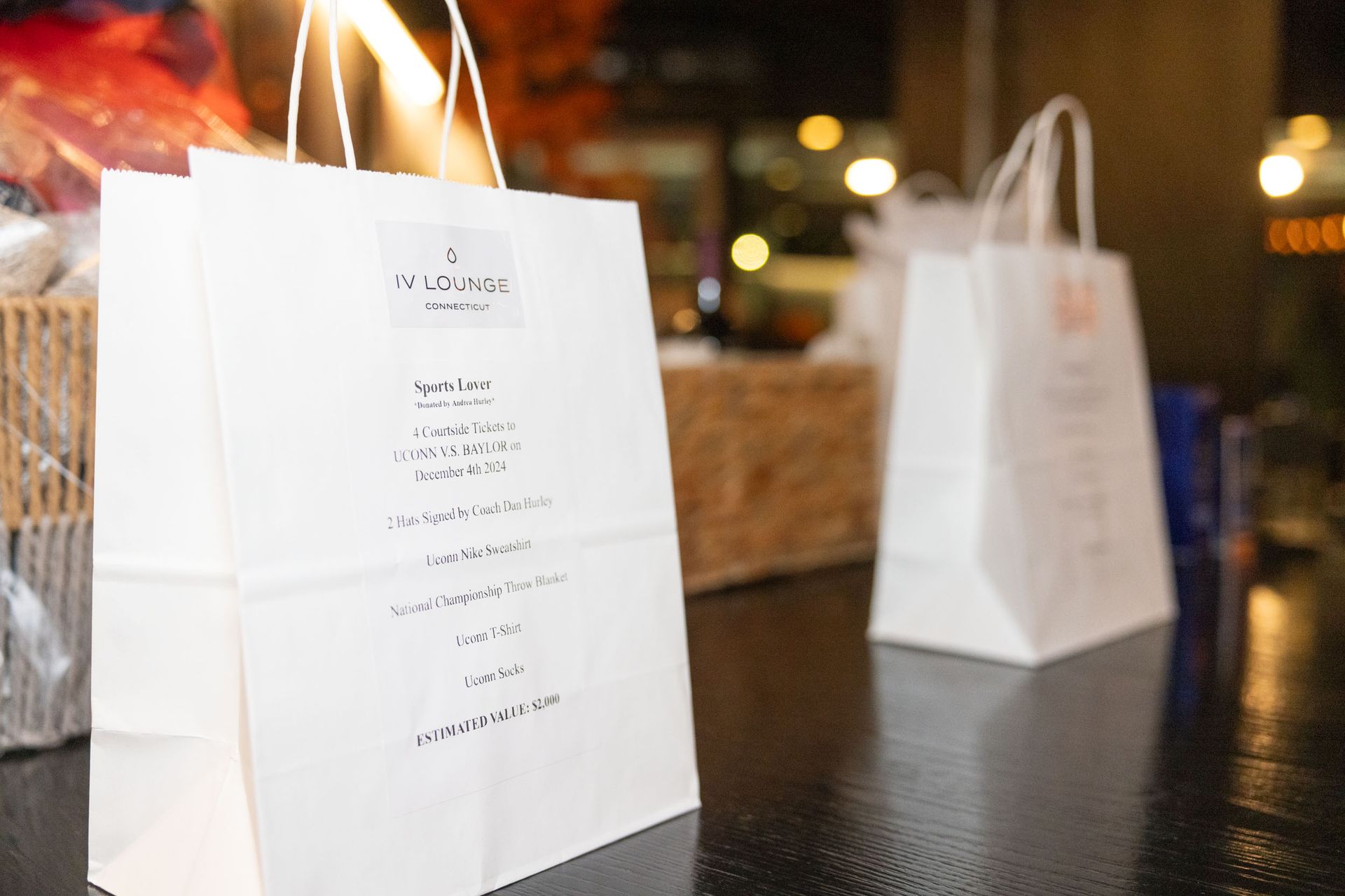 A white paper bag with a menu on it is sitting on a table.