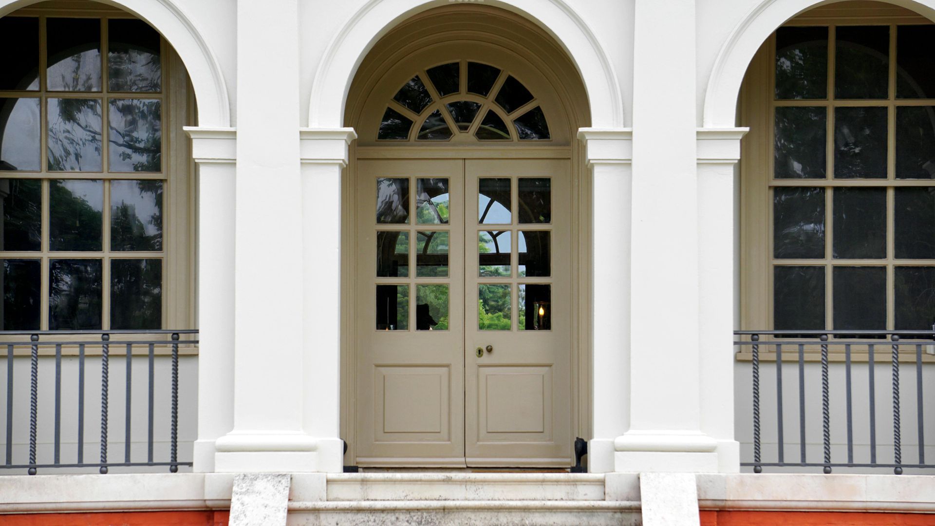 Door and window trim freshly painted on a home in Marshall County