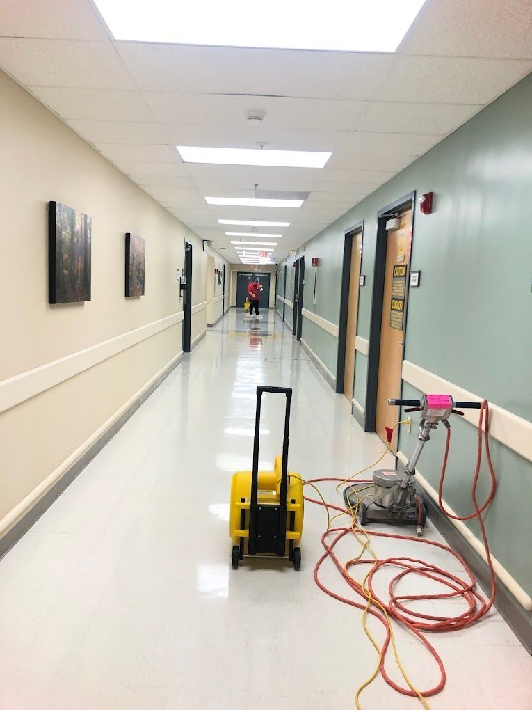A long hallway with a yellow trolley in the middle