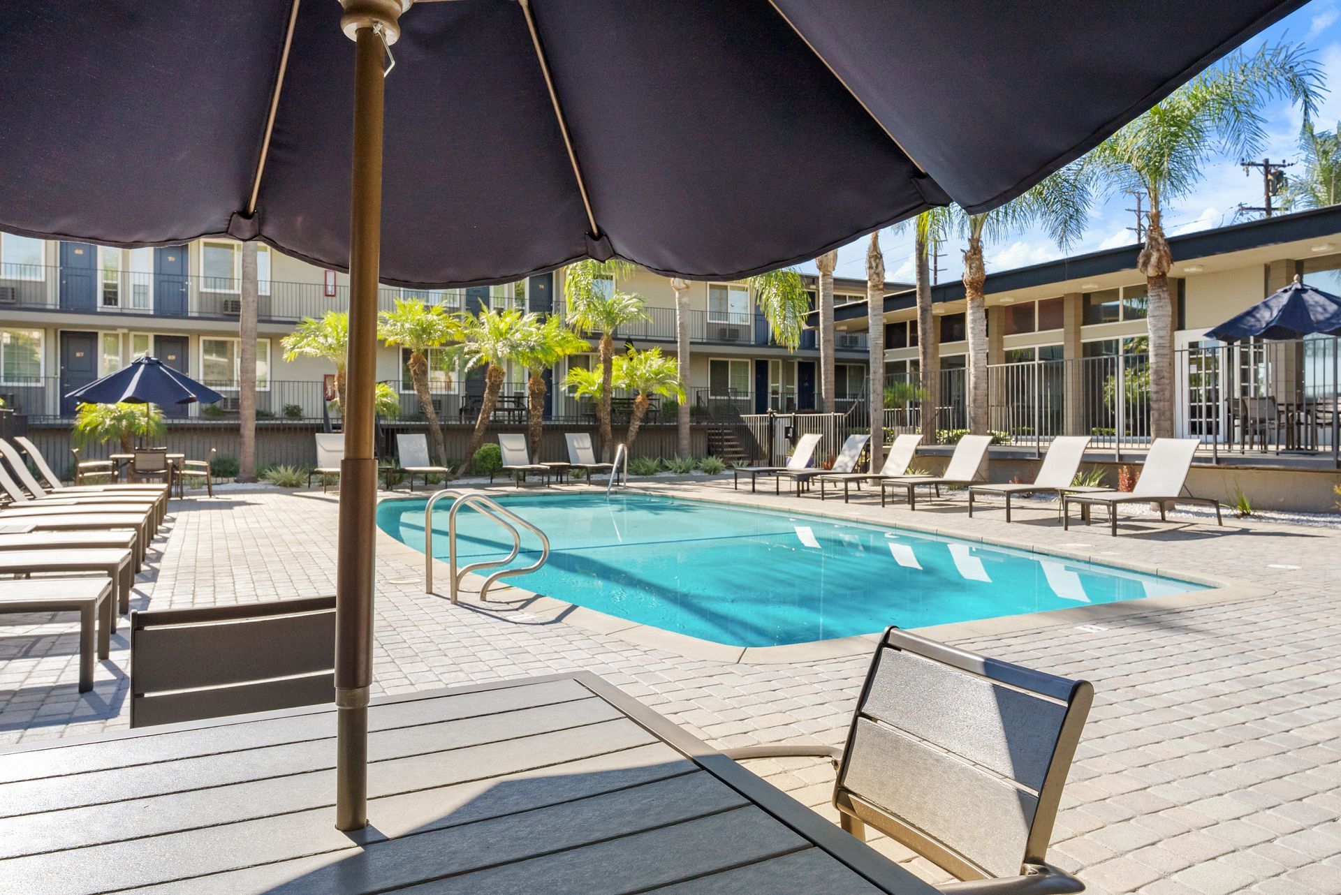 Pool with umbrellas and lounge chairs