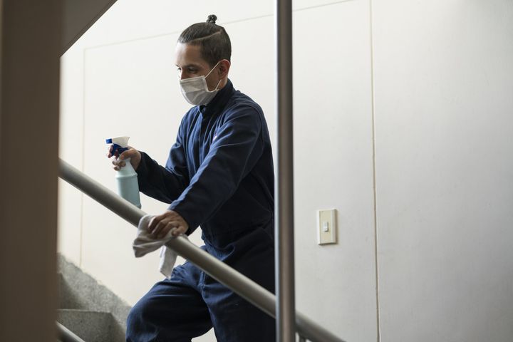 Man Wiping the Stairs - Northridge, CA - Executive-Suite Services Man Wiping the Stairs - Northridge, CA - Executive-Suite Services