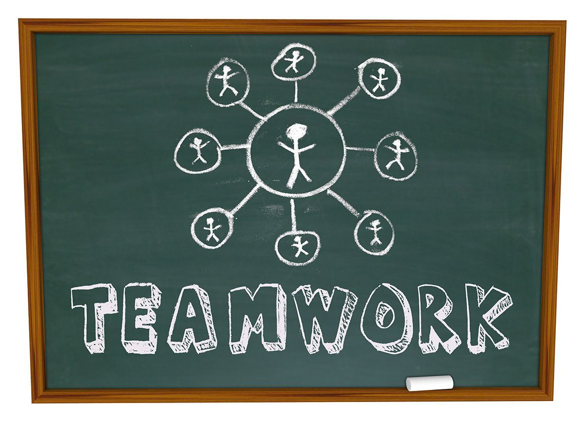 chalkboard featuring teamwork characterizing the Backpack Buddies board