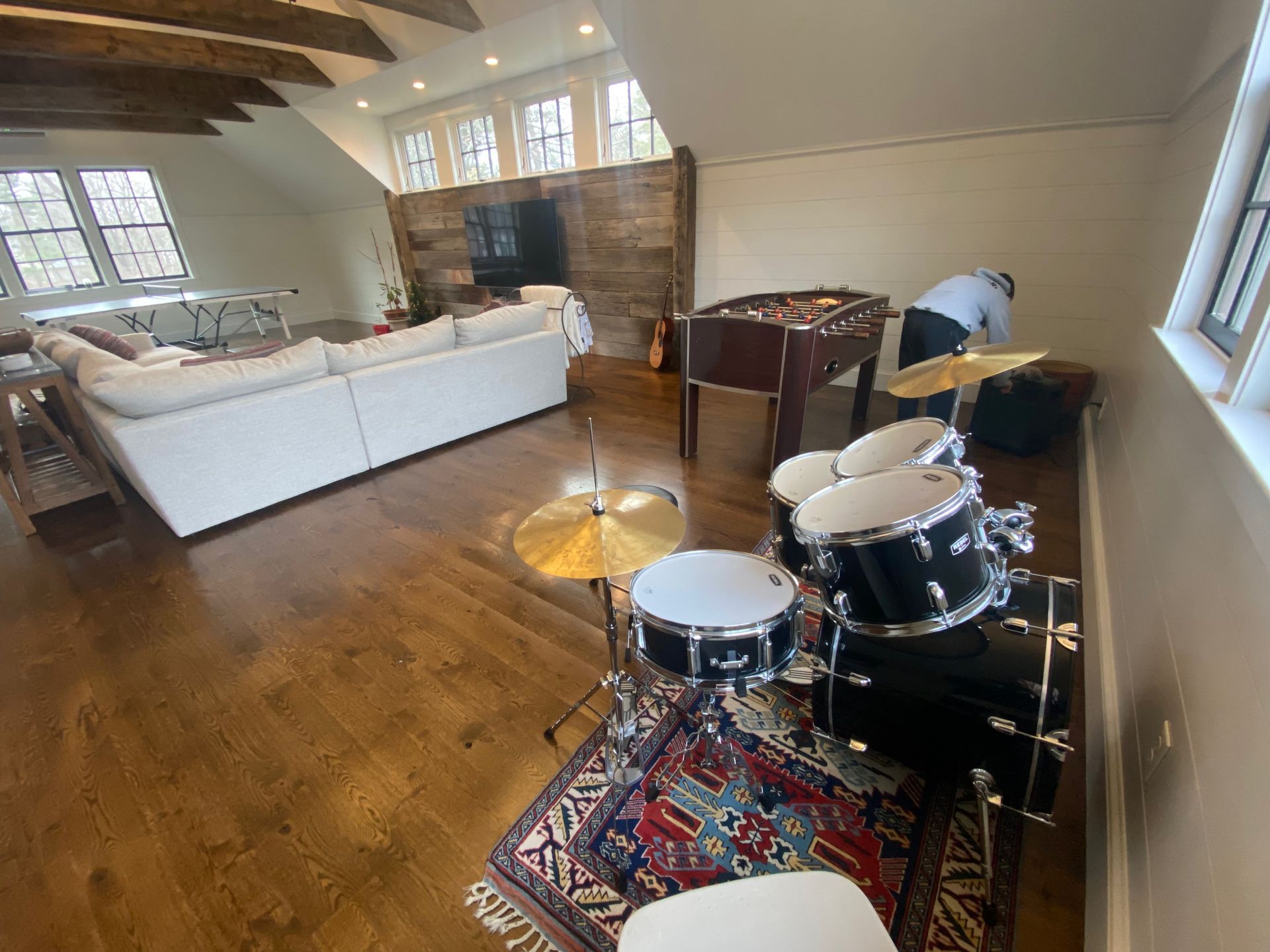 side view of a drum set in a practice room