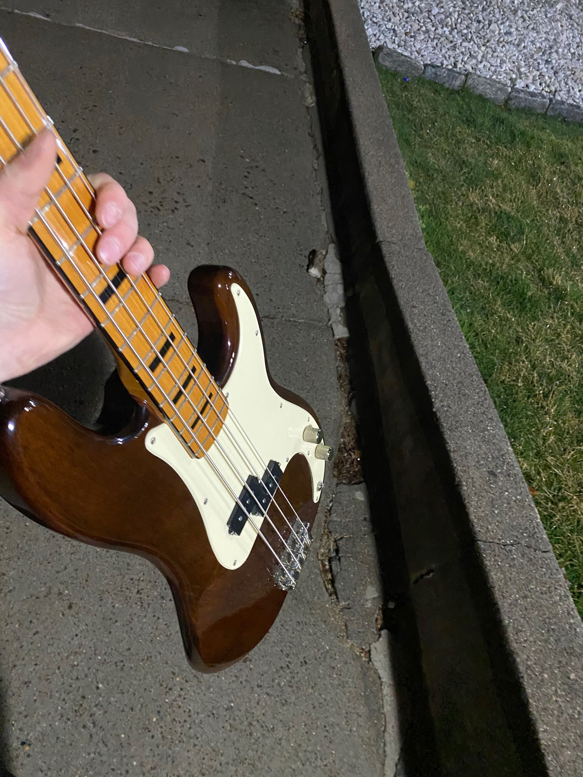 an electric guitar being held