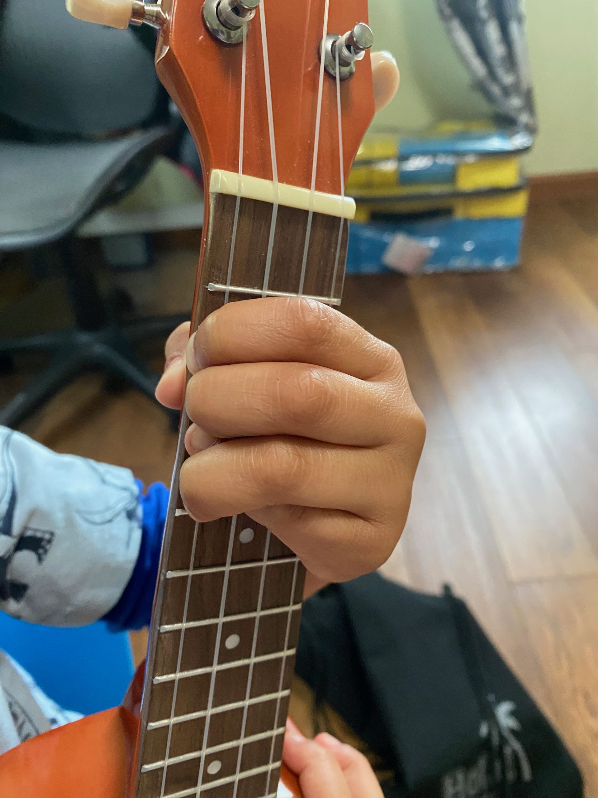 pressing a chord on a acoustic guitar