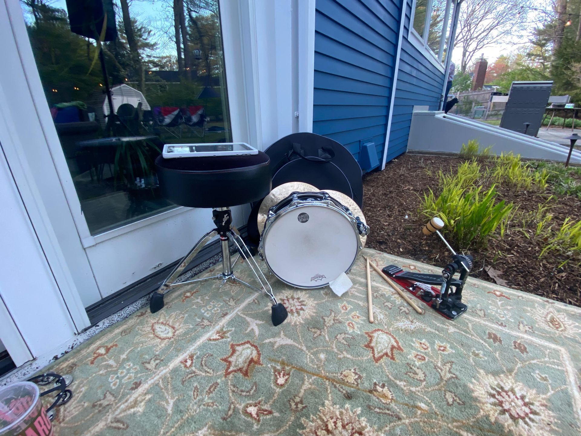 covered up drum kits outside the house