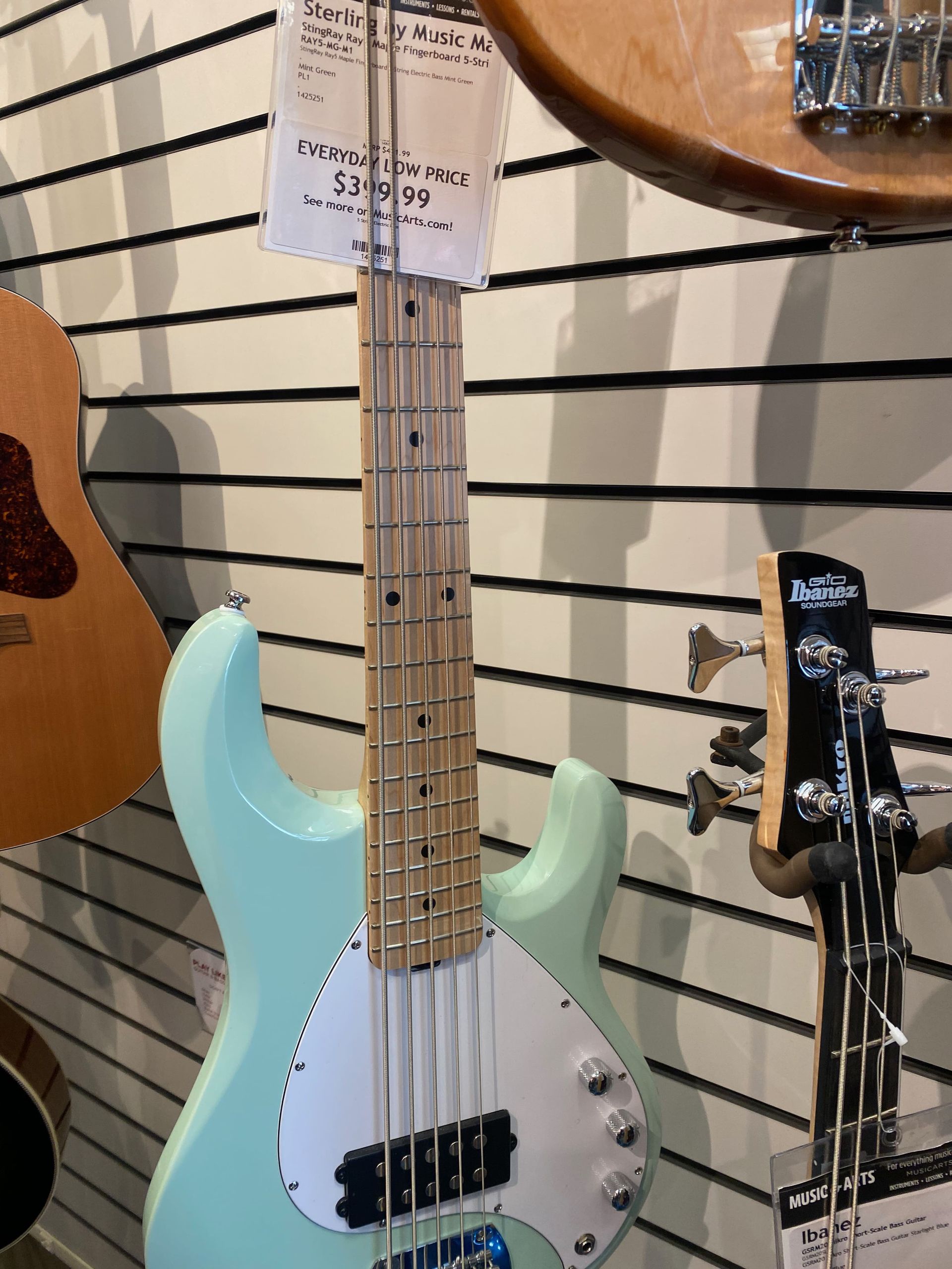 teal colored electric guitar