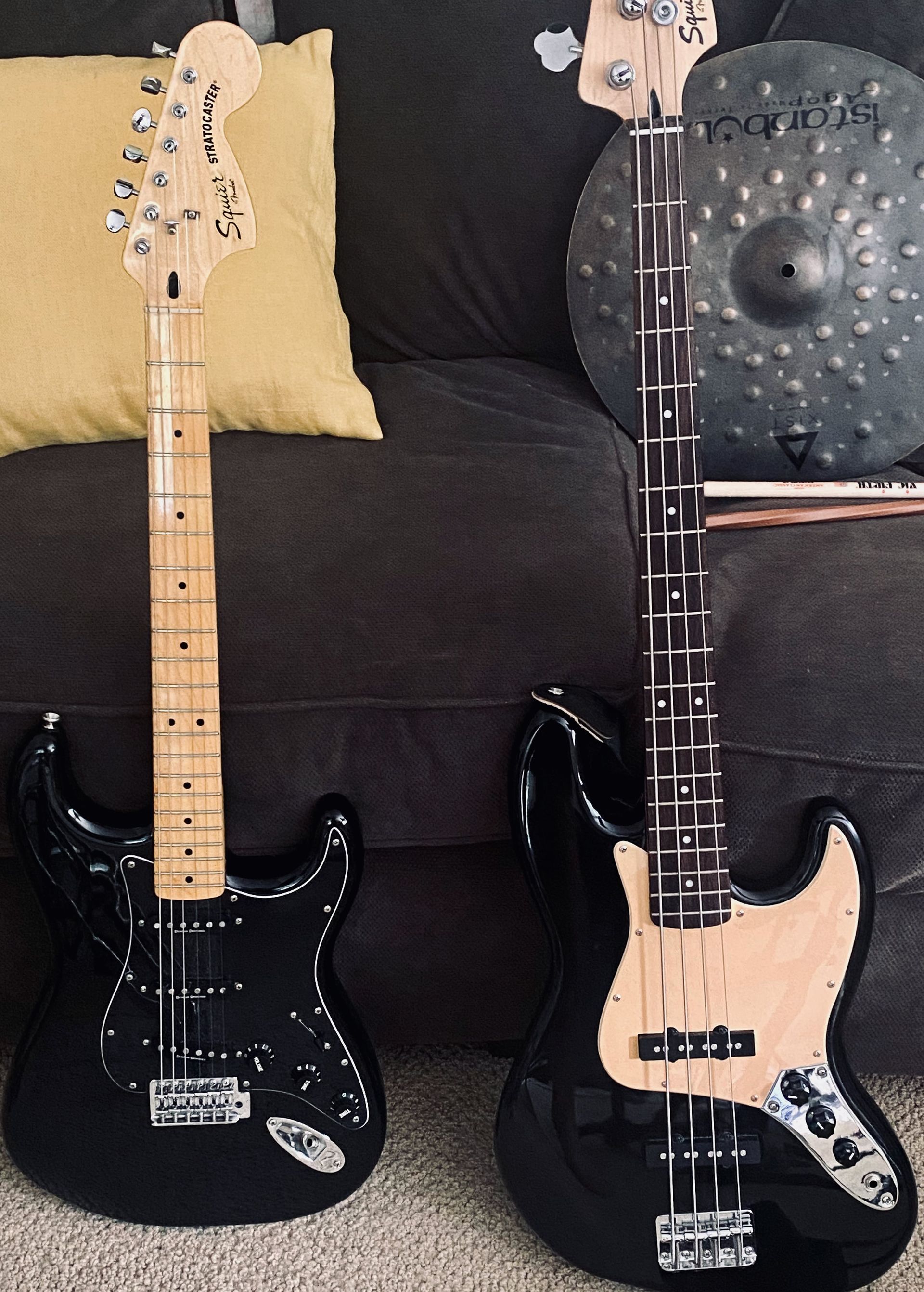 two black electric guitars