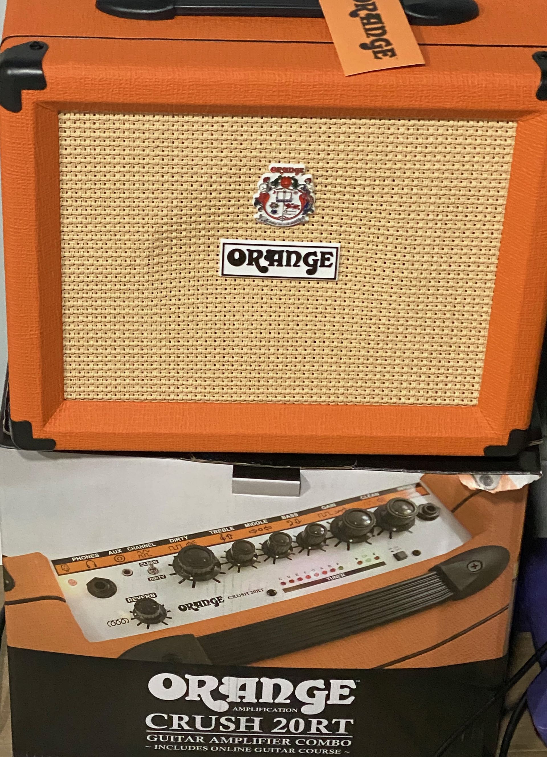 an orange amplifier and a sound mixer
