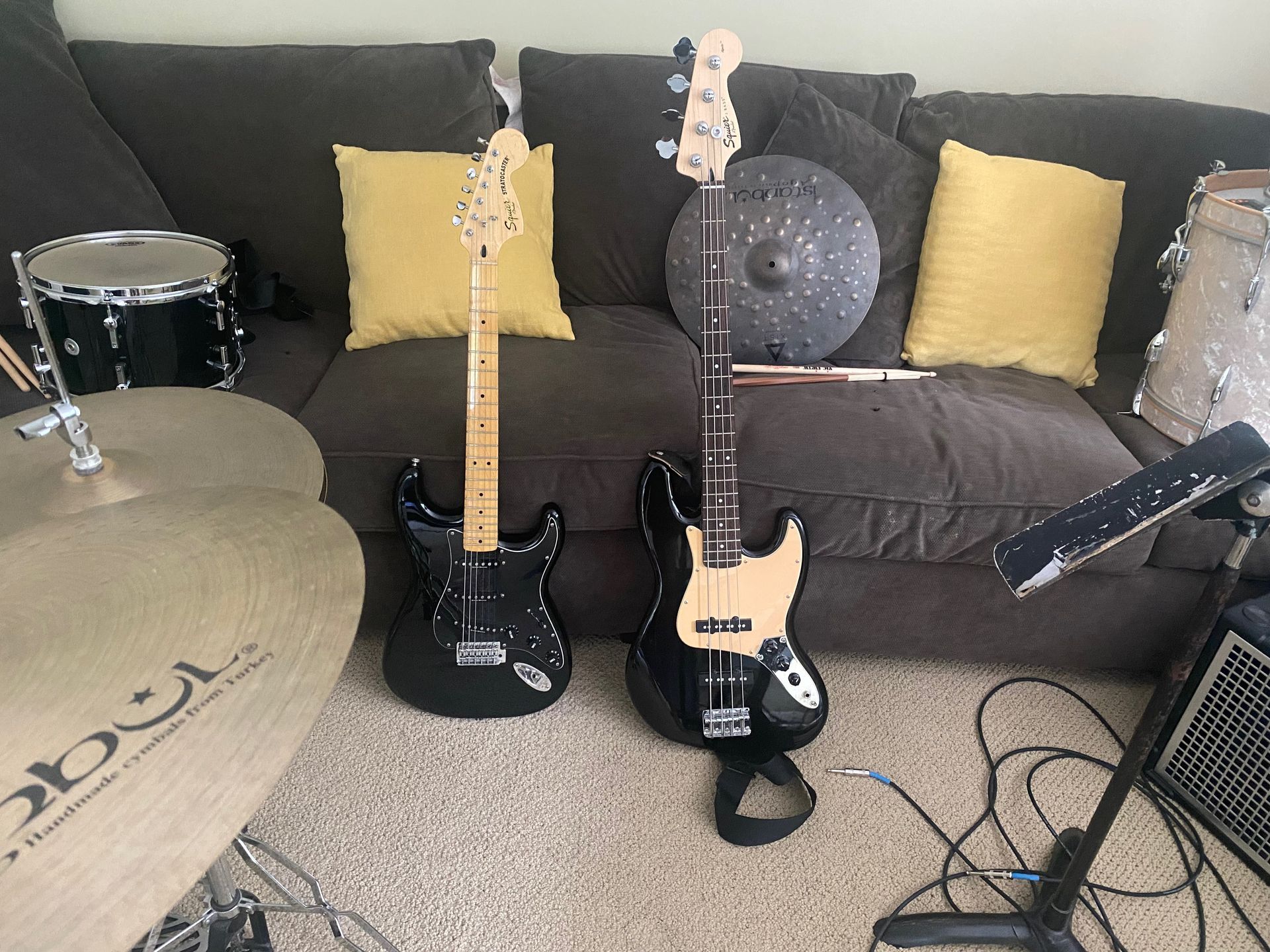 two black electric guitars
