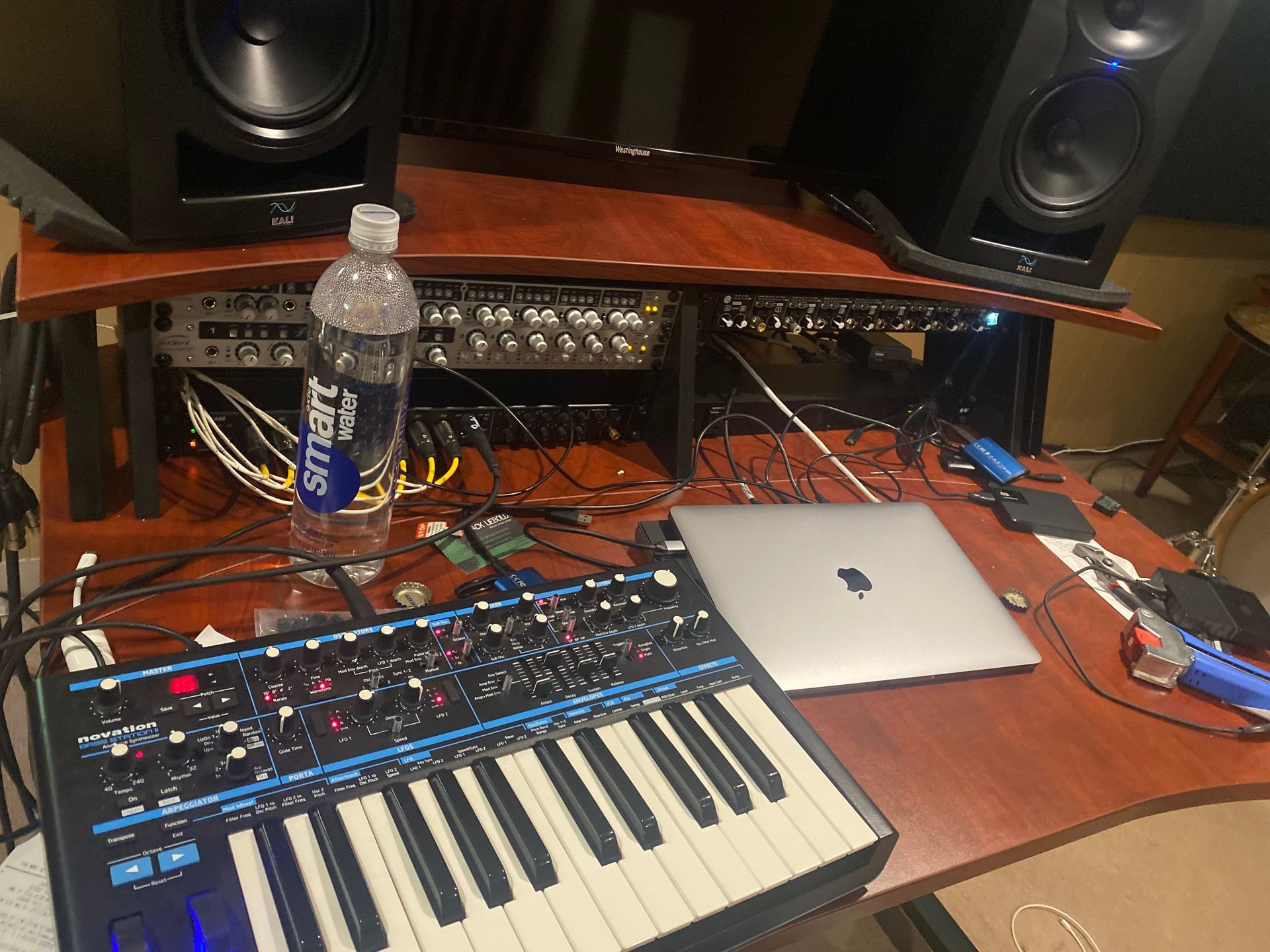 view of a recording studio with a beat maker and sound mixers