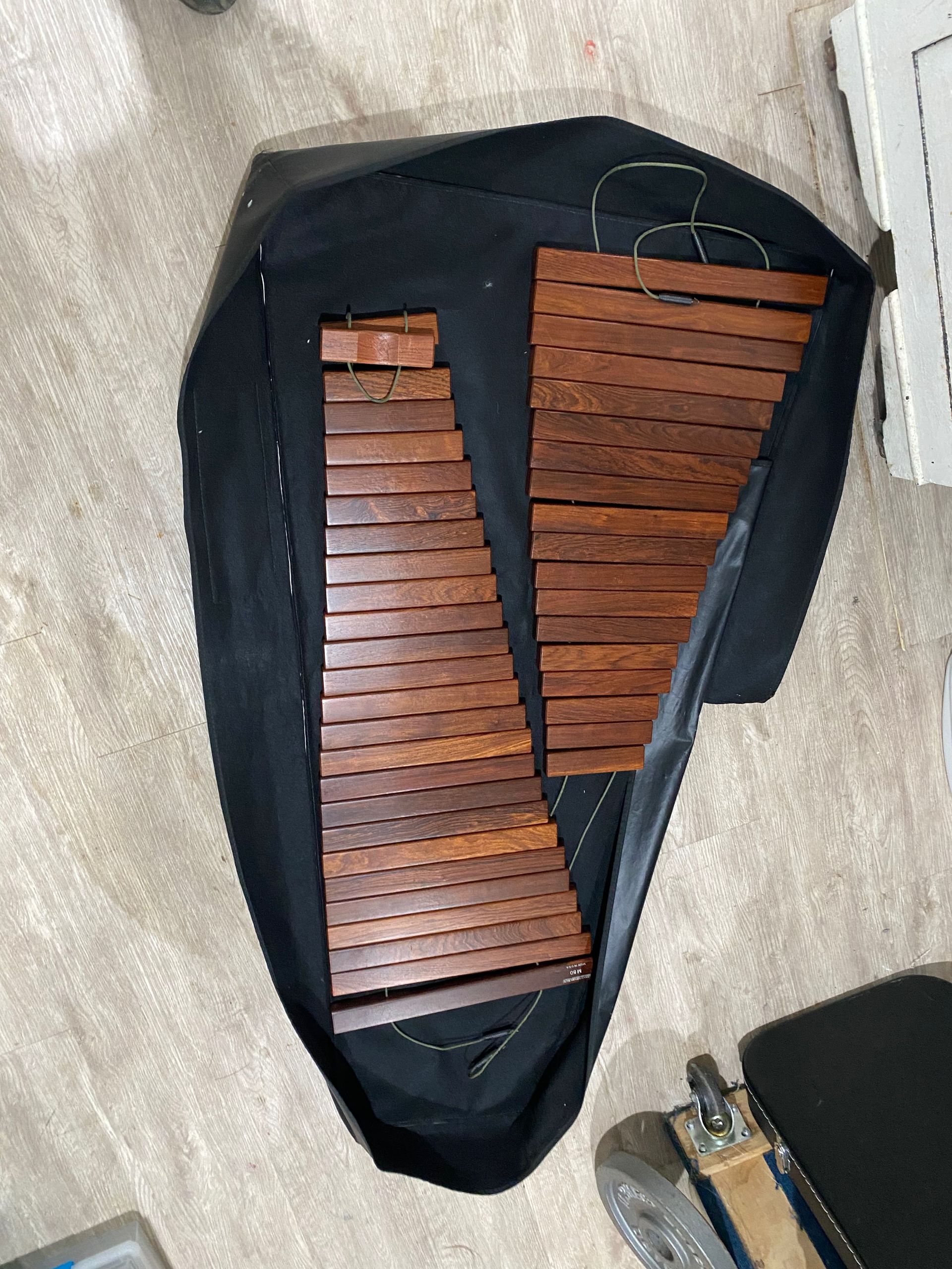 a brown xylophone sitting on its cover