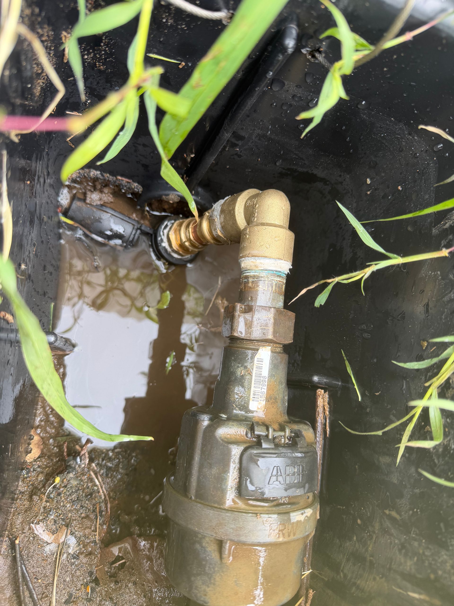 Broken pipe fitting leaking into a black pit — Truflow Plumbing & Gas Solutions in Rockhampton City, QLD