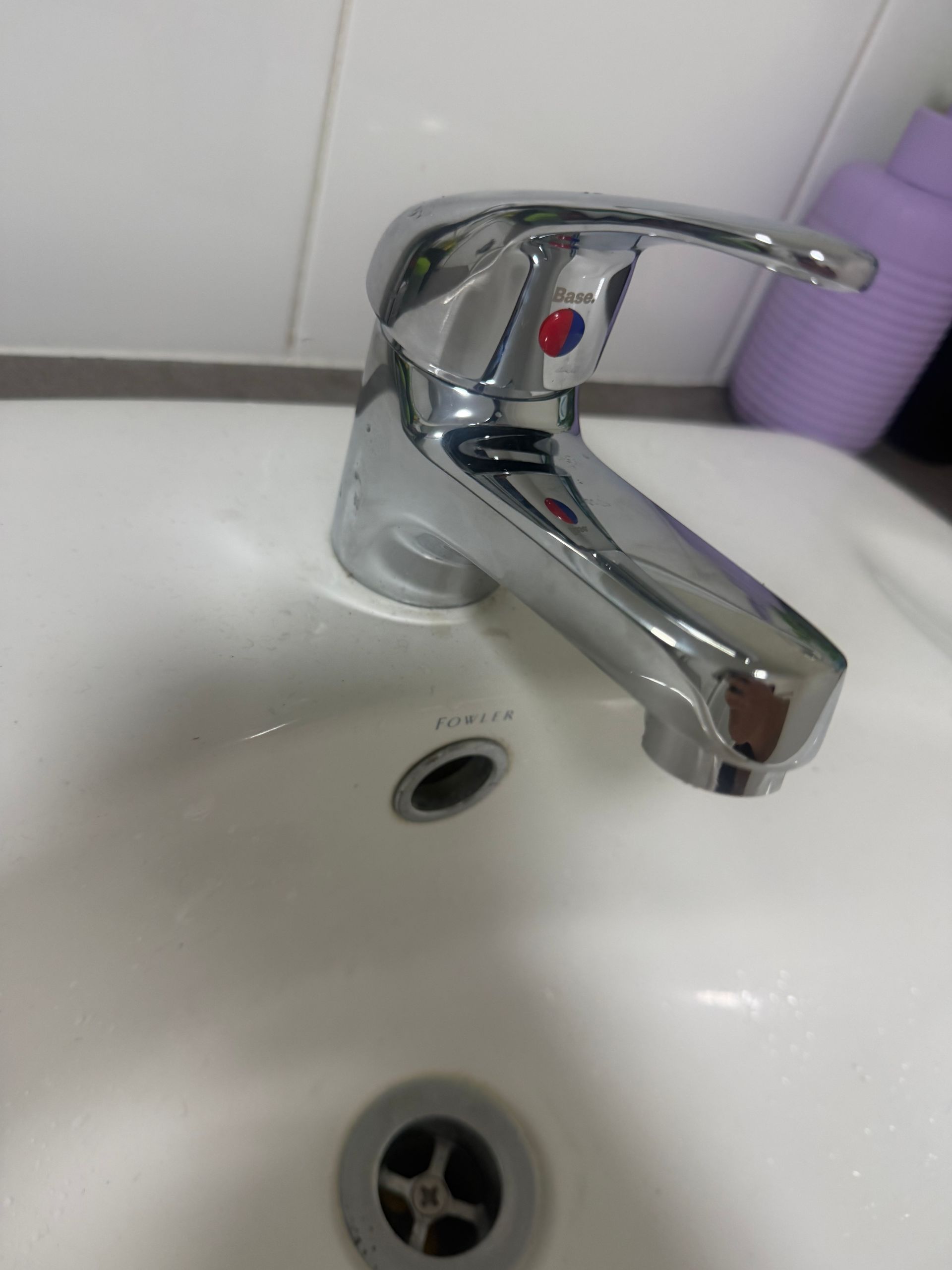 Chrome faucet over a white sink with drain and overflow hole — Truflow Plumbing & Gas Solutions in Rockhampton City, QLD