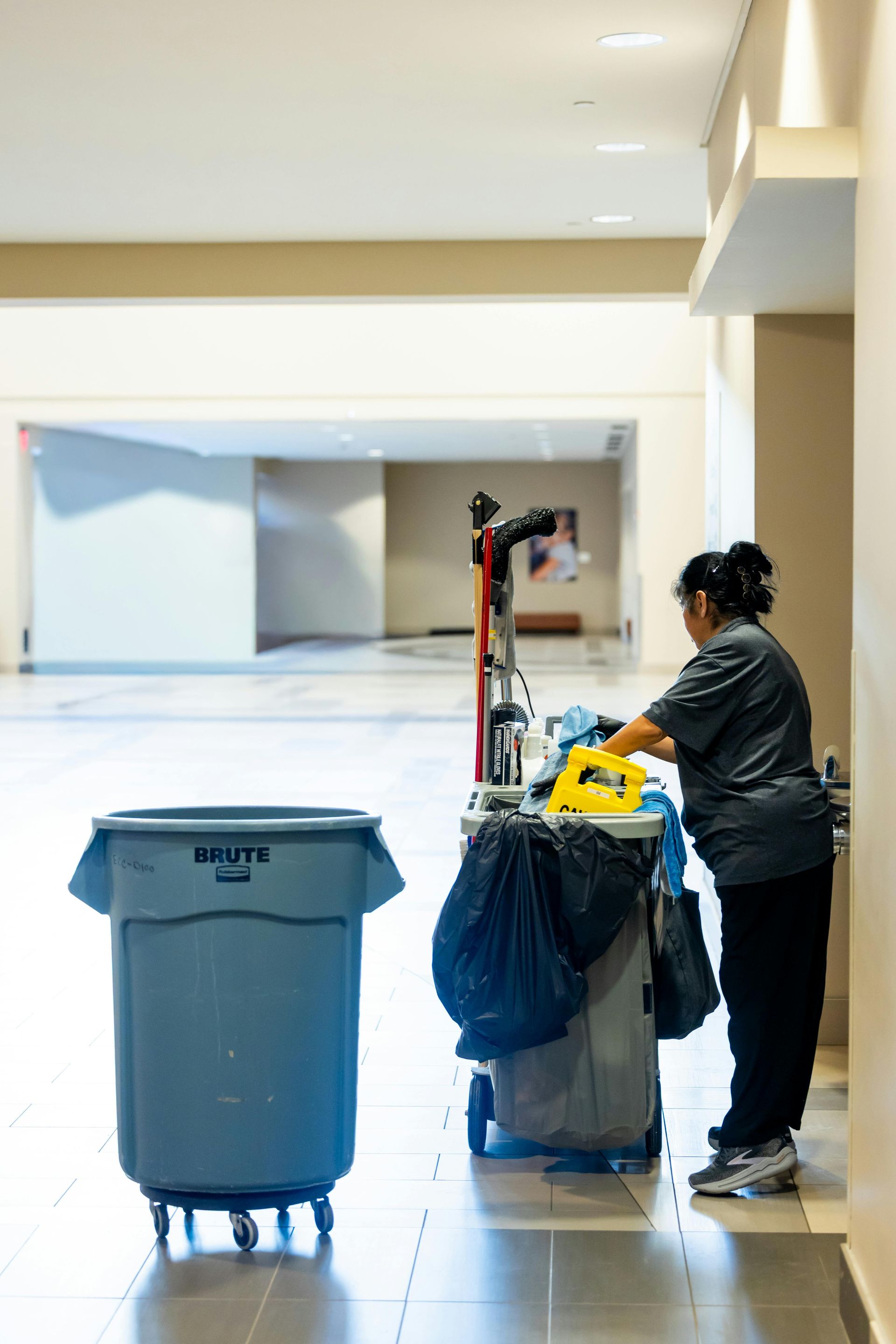 A school janitor throwing garbage
