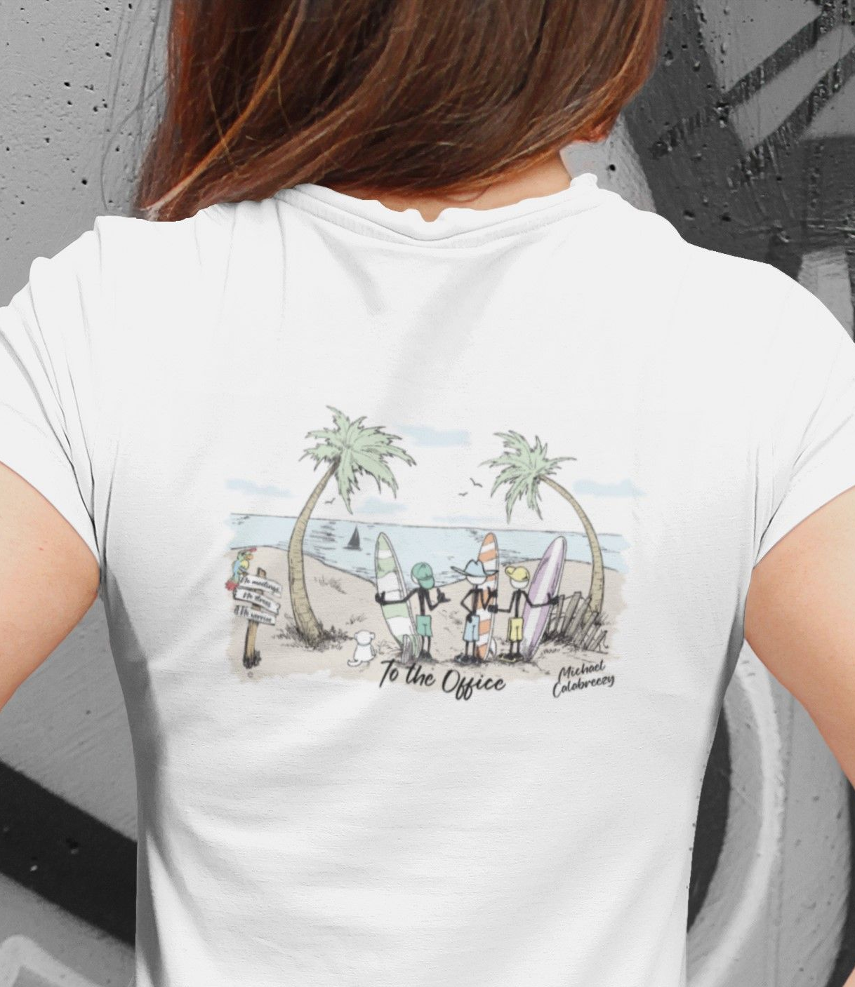Woman wearing a white T-shirt with a tropical beach graphic on the back