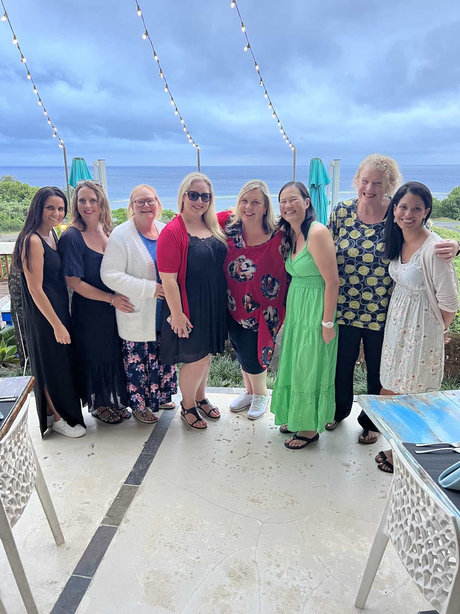 A NOWW women group photo by the sea
