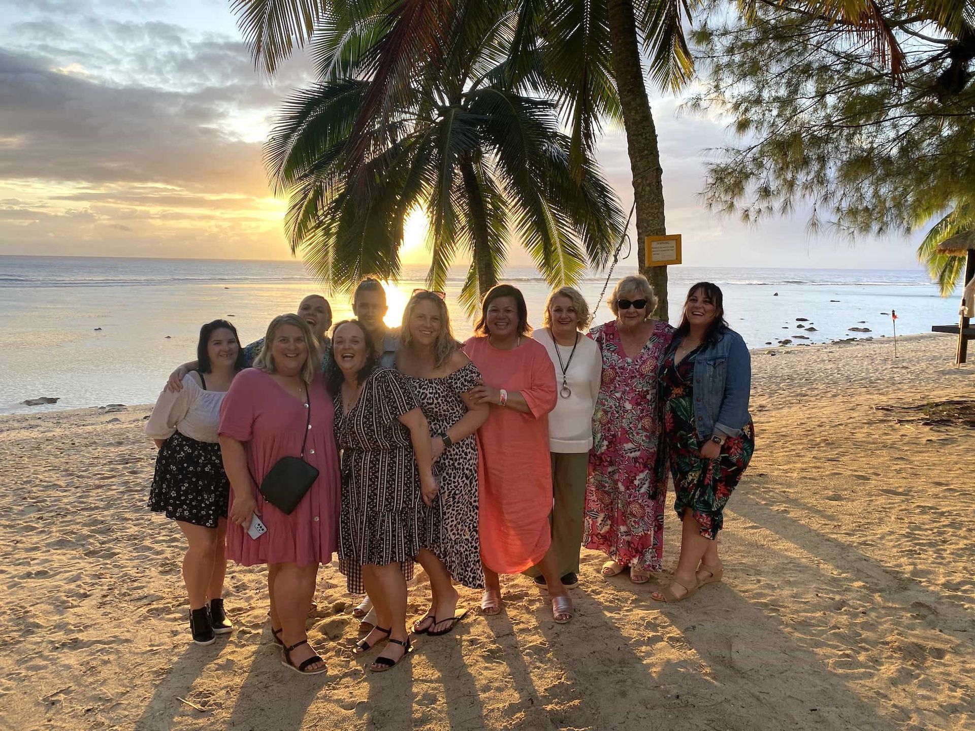 Sunset group photo on the beach with NOWW