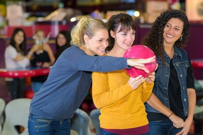 Woman trying to play bowling