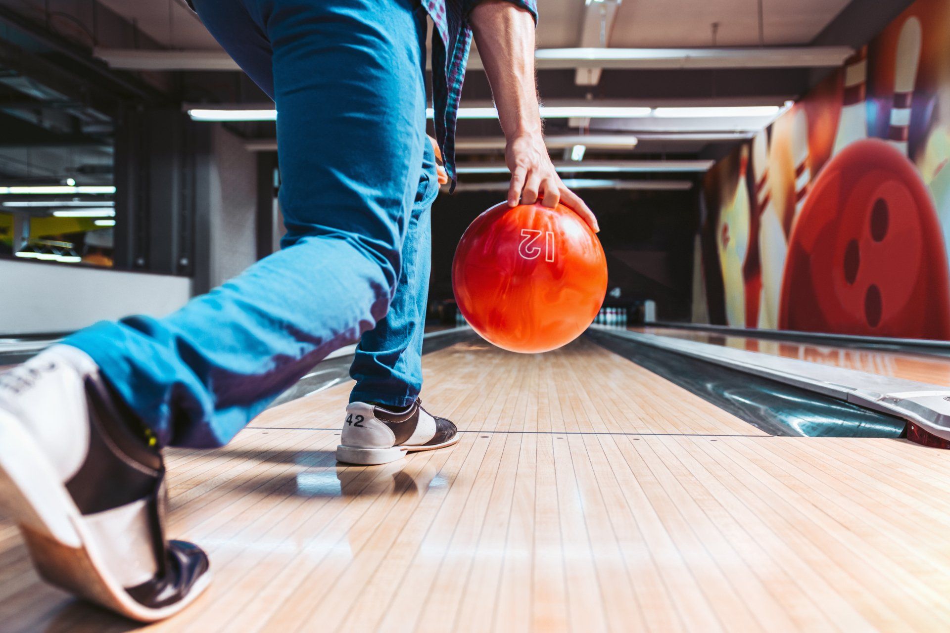 man throwing bowling ball