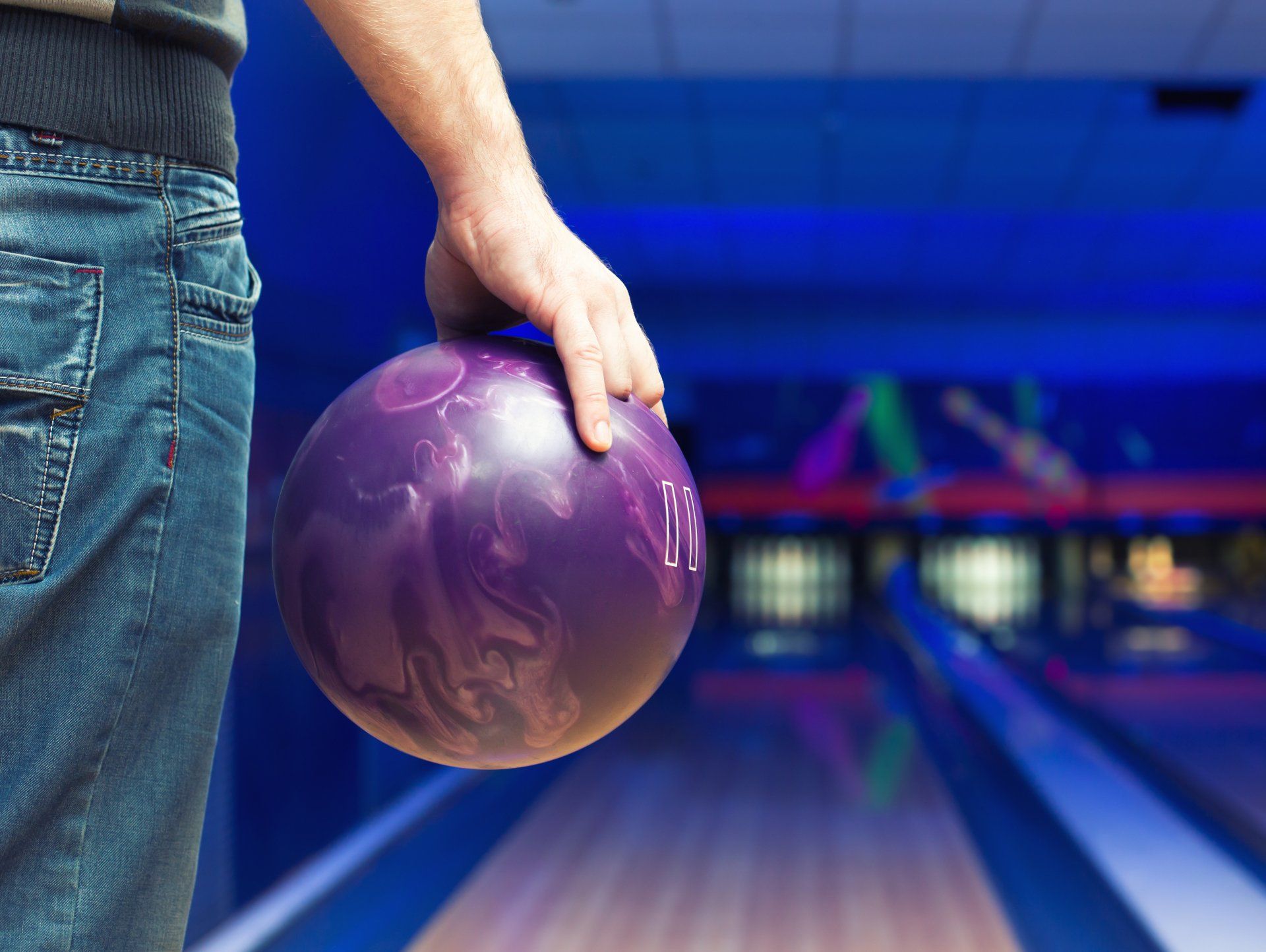 man holding bowling ball