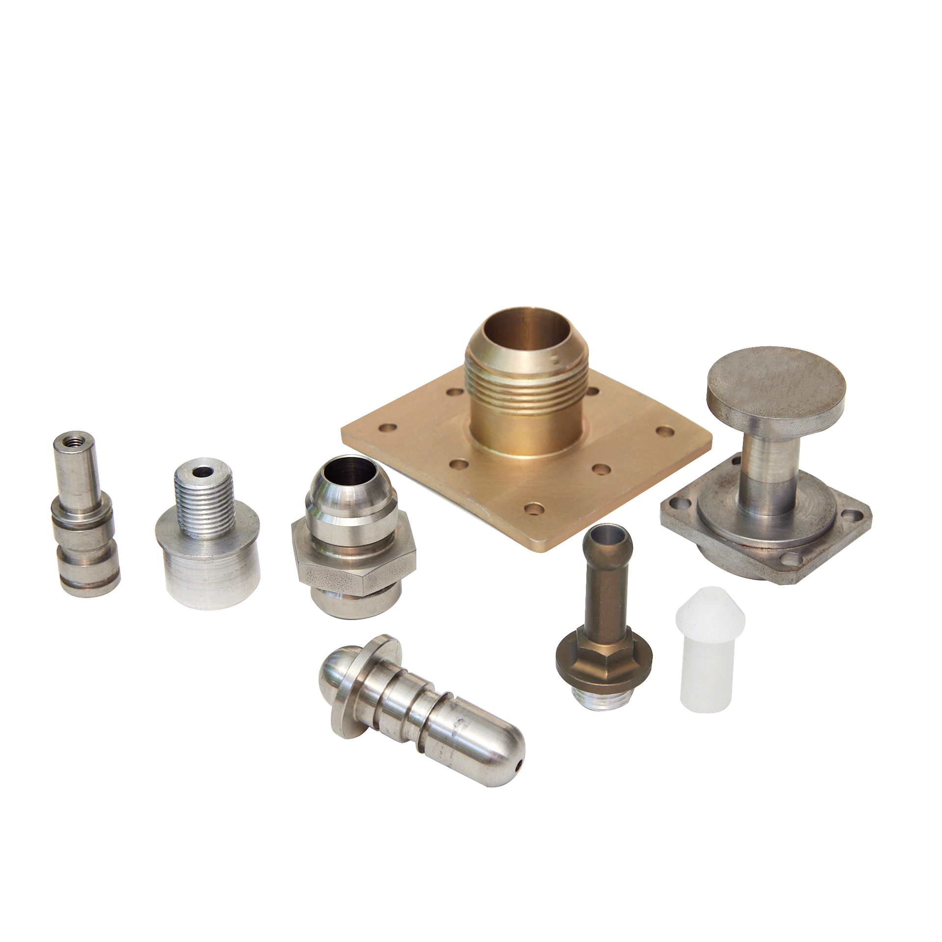 A group of metal parts are sitting on top of each other on a white surface.