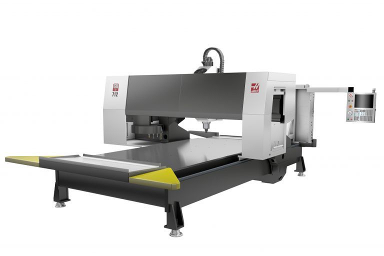 A machine is sitting on top of a table on a white background.