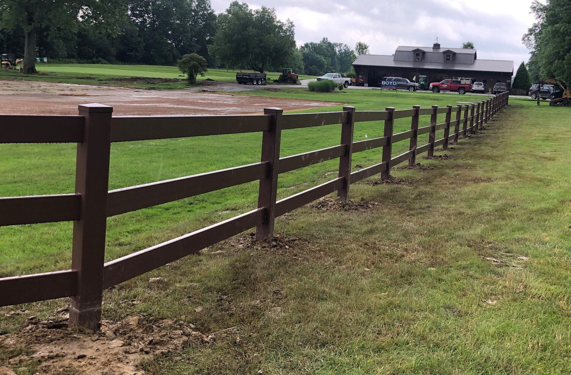 Brown 3 rail fence installed by Metal Fence Supply Co.