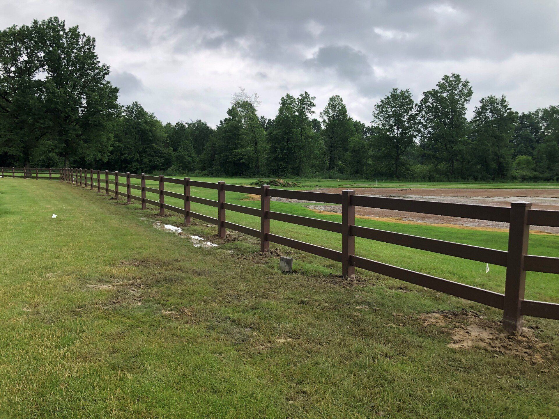 Brown rail vinyl fence from Metal Fence Supply Co. 