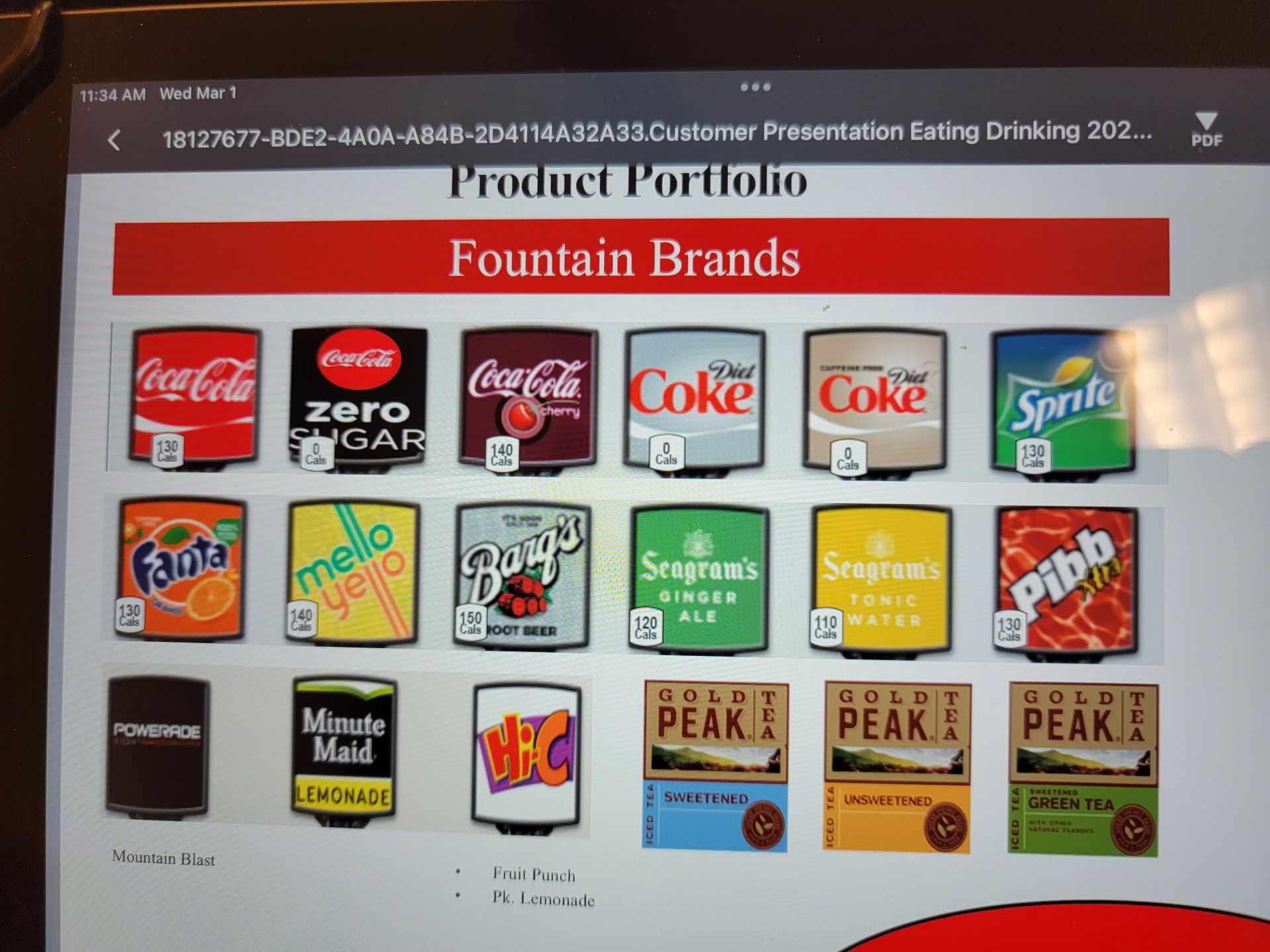 A screen shows a variety of sodas including coca cola coke and sprite