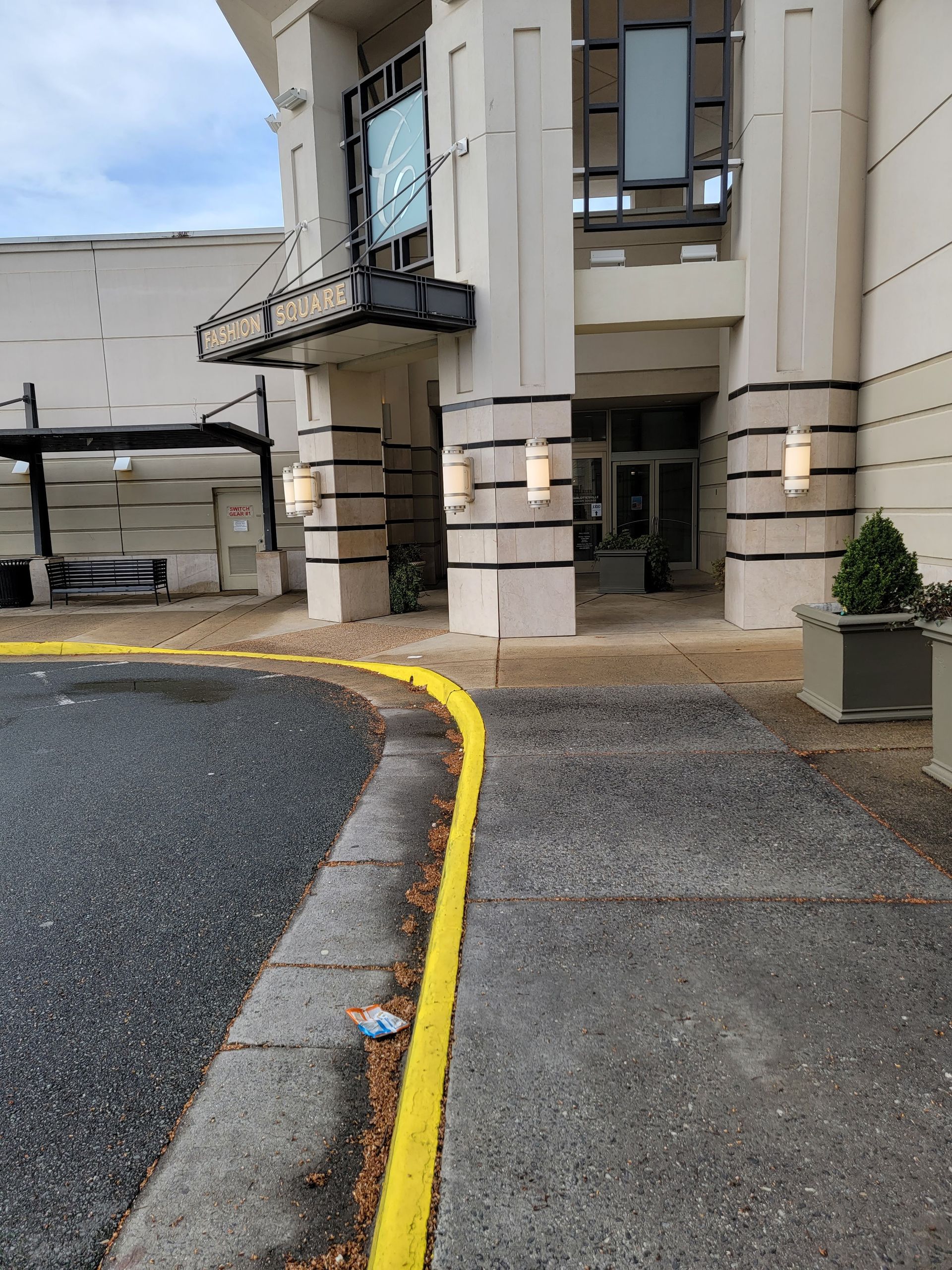 A building with a yellow curb in front of it