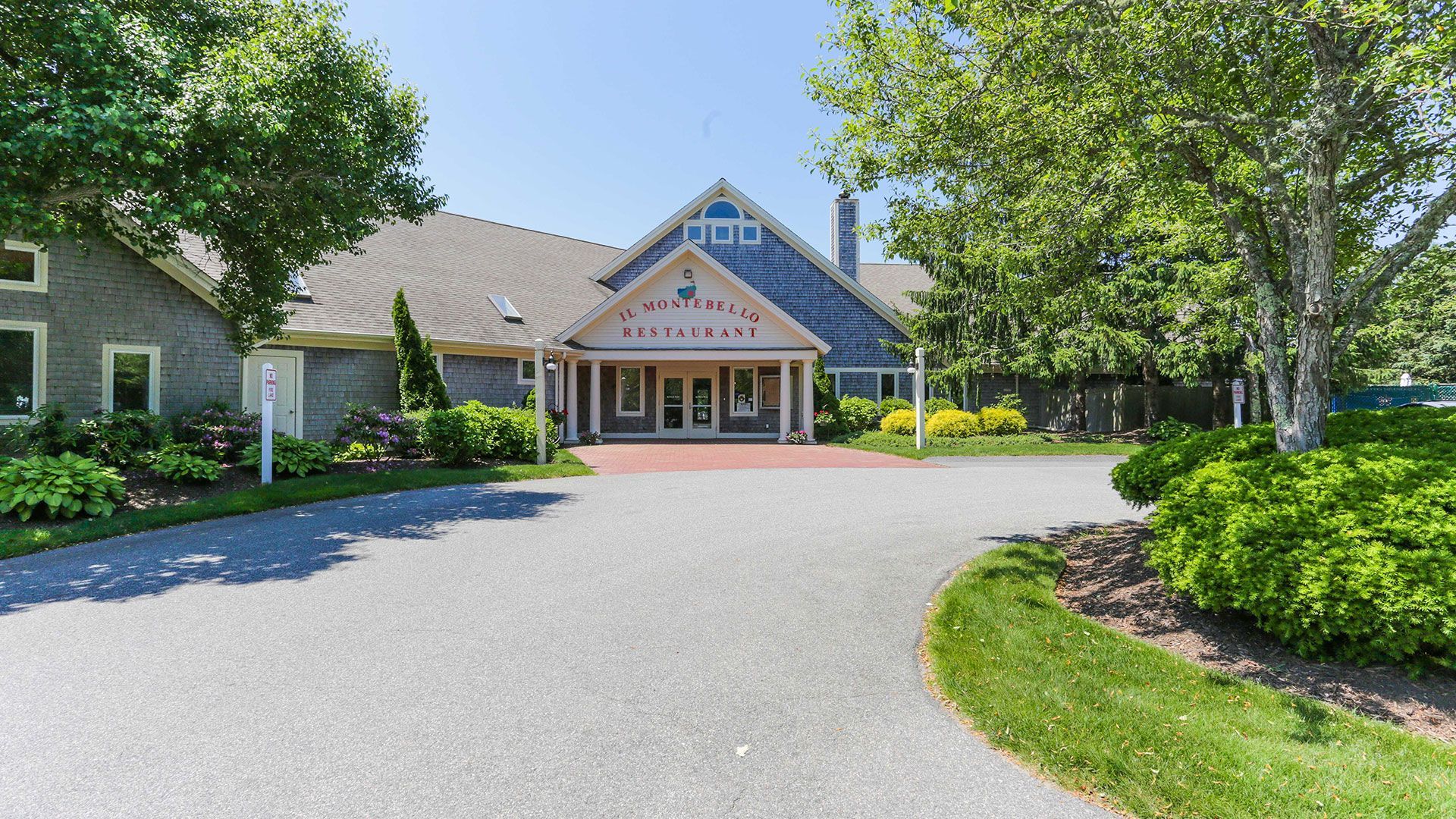 A large house with a driveway leading to it
