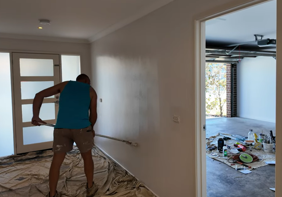 Professional interior painter applying fresh paint to residential walls during a home painting project in Cranberry Township, PA