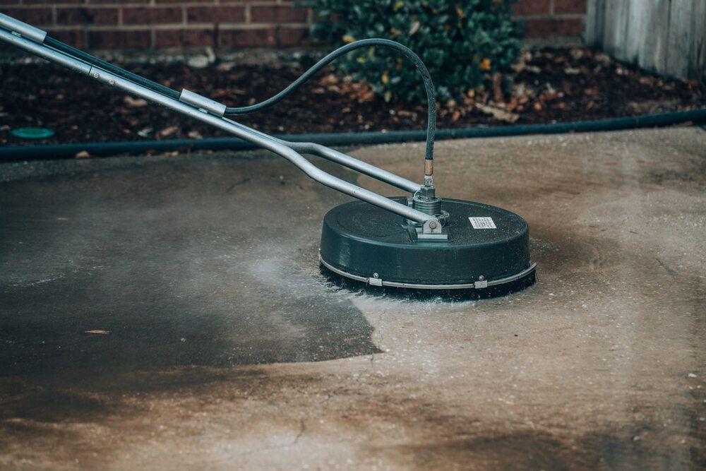 Pressure washing a driveway