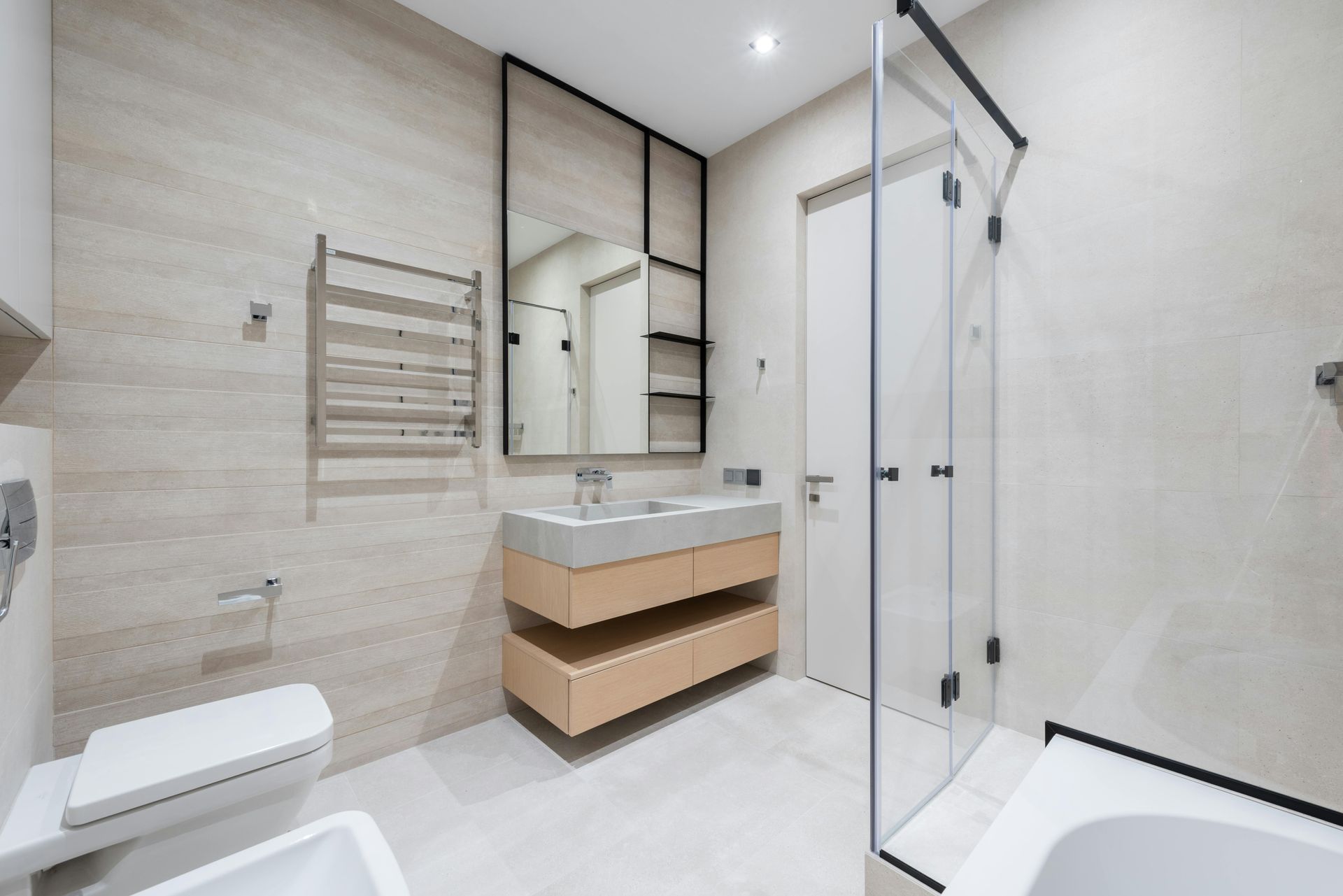 A new bathroom with plumbing, tiling and shower also bathroom cabinets fitted.