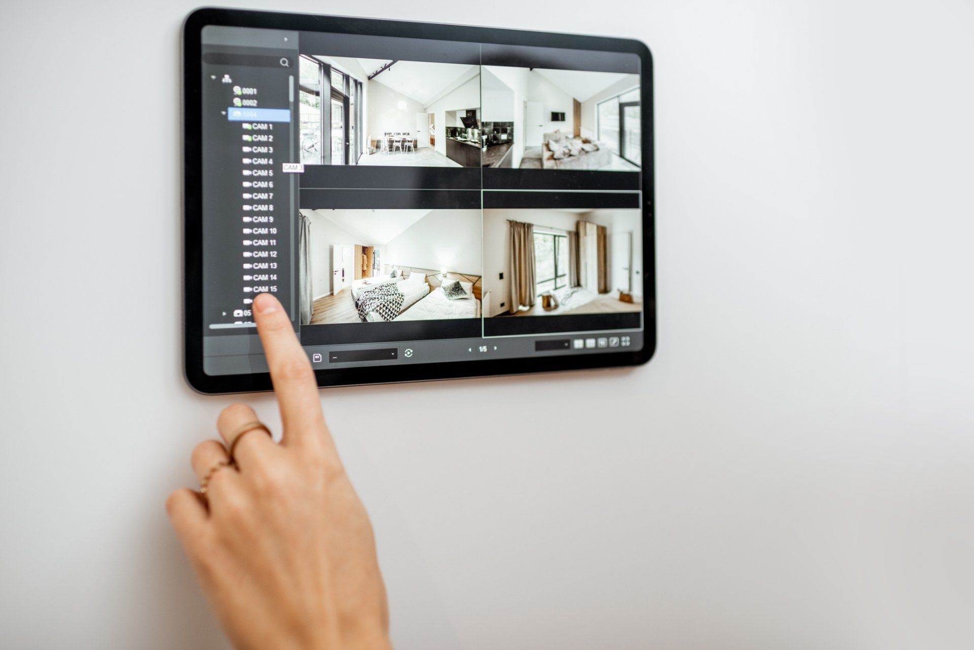 Person using home security system — Cerritos, CA — Southern California Security Centers Inc