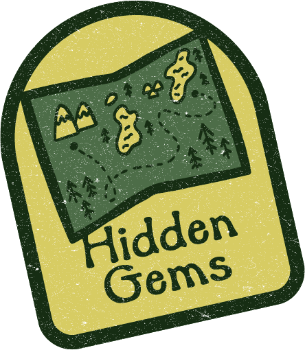 Hidden Gems logo with a green map and yellow pin-shaped gems on a cream background