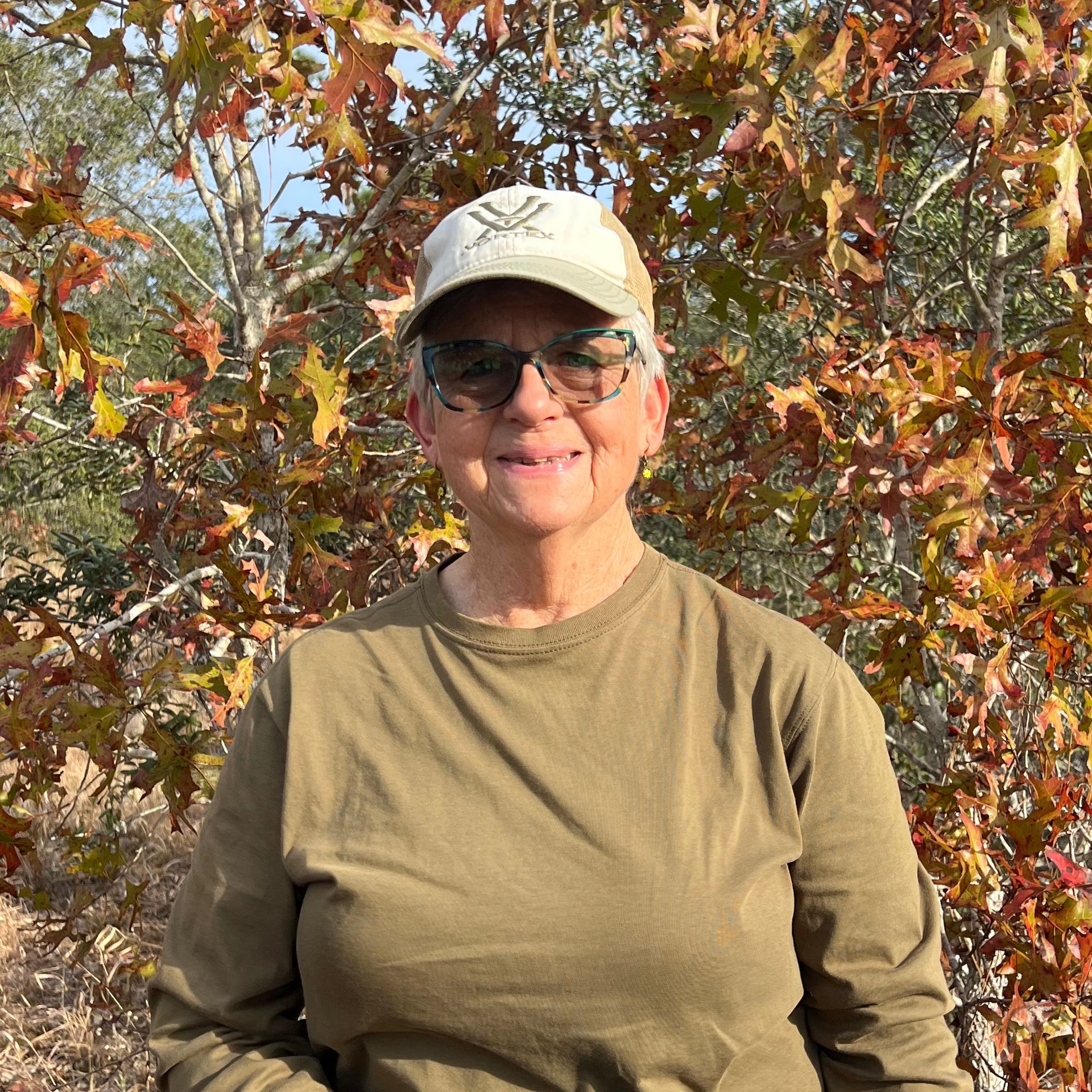 Photo of Rosi Mulholland standing in the winter in front of a turkey oak on a rescue site