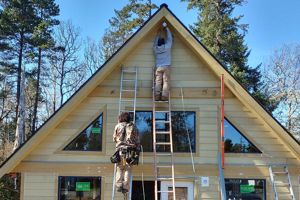 Roof Workers on Top of House — Vancouver, WA — Mountainside Roofing LLC Roof Workers on Top of House — Vancouver, WA — Mountainside Roofing LLC