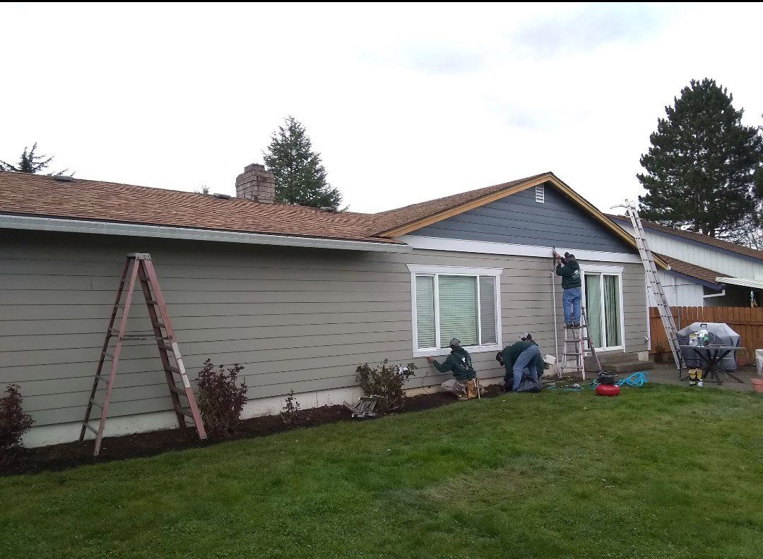 Installer Replacing Siding — Vancouver, WA — Mountainside Roofing LLC