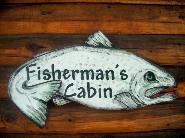 Sign shaped like a fish that reads