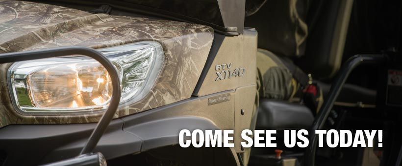 Side view of a camo vehicle with the text 