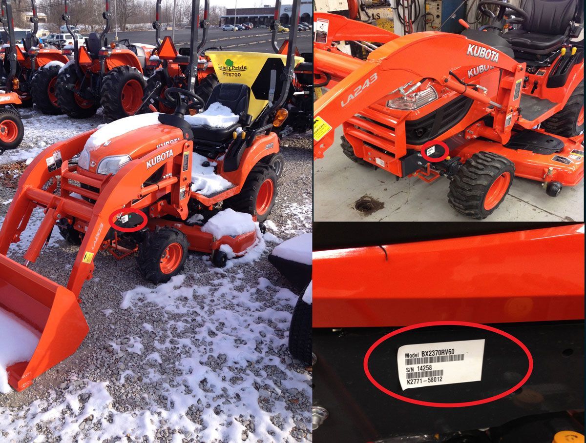 Orange tractor with loader, parked on snowy ground. Tag visible.
