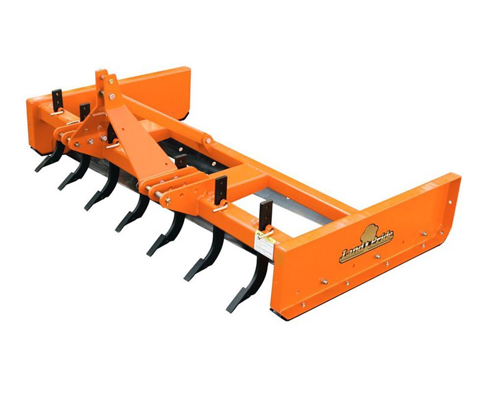 Orange tractor box blade with ripper teeth, used for grading and leveling soil.