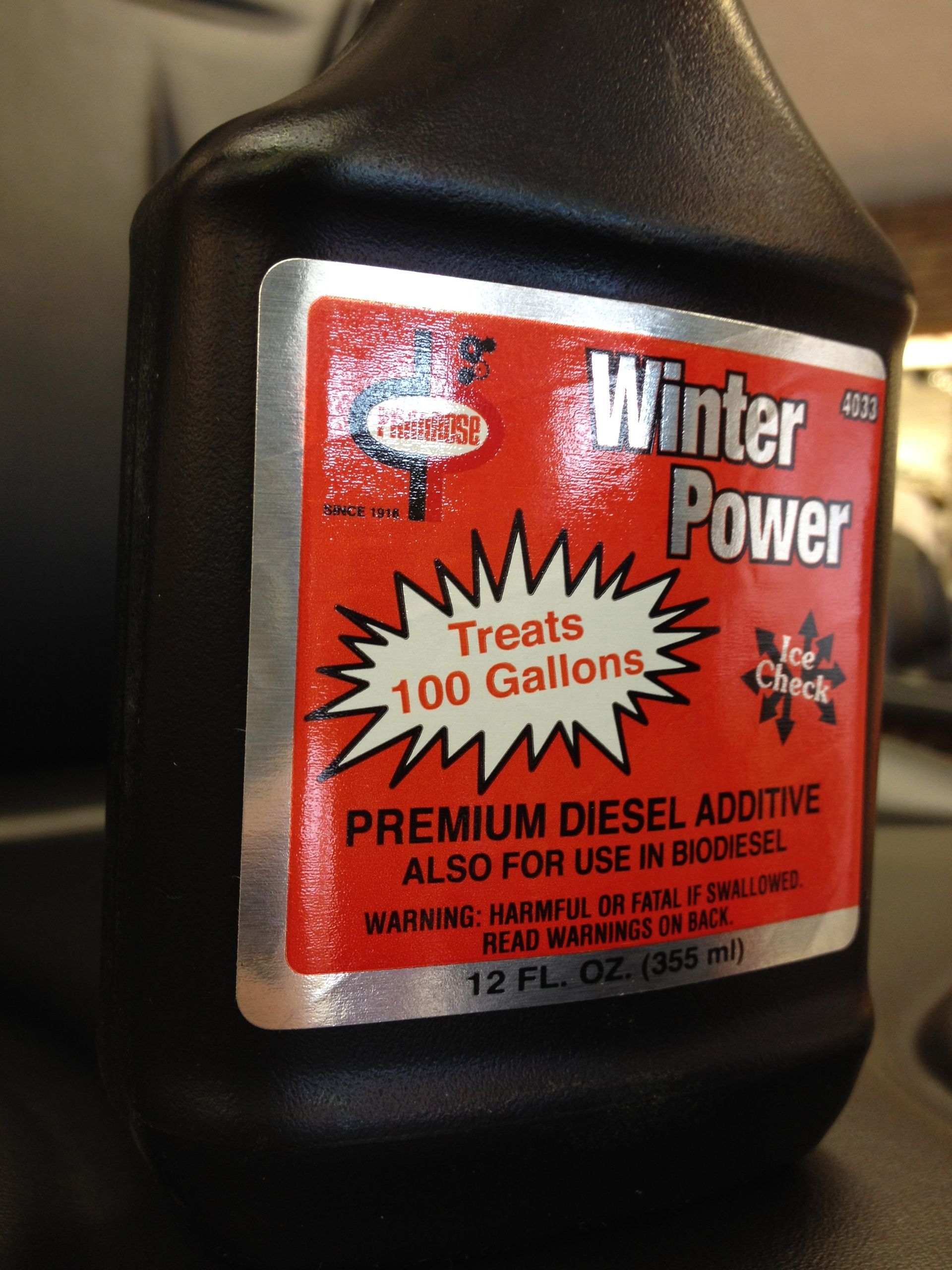 Black bottle with red and white label,