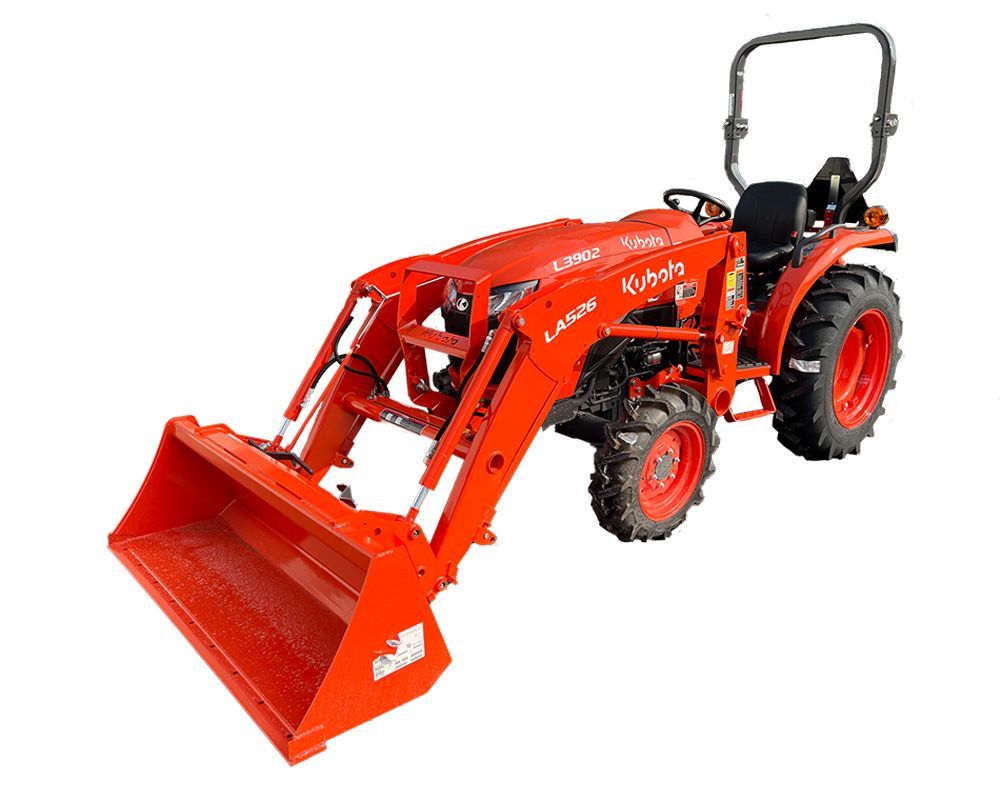Orange compact tractor with front-end loader; outdoor setting.