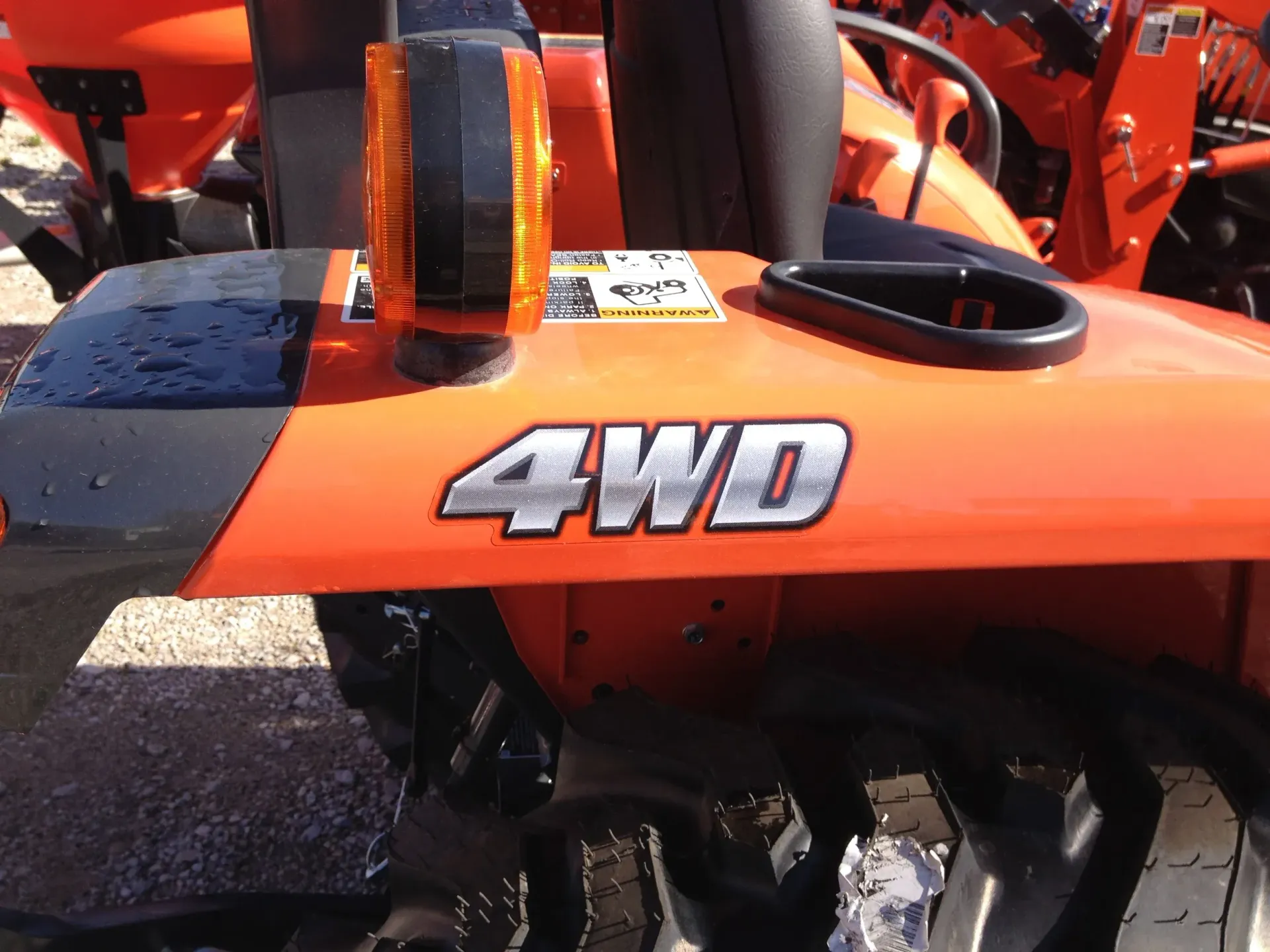 Orange tractor fender with 
