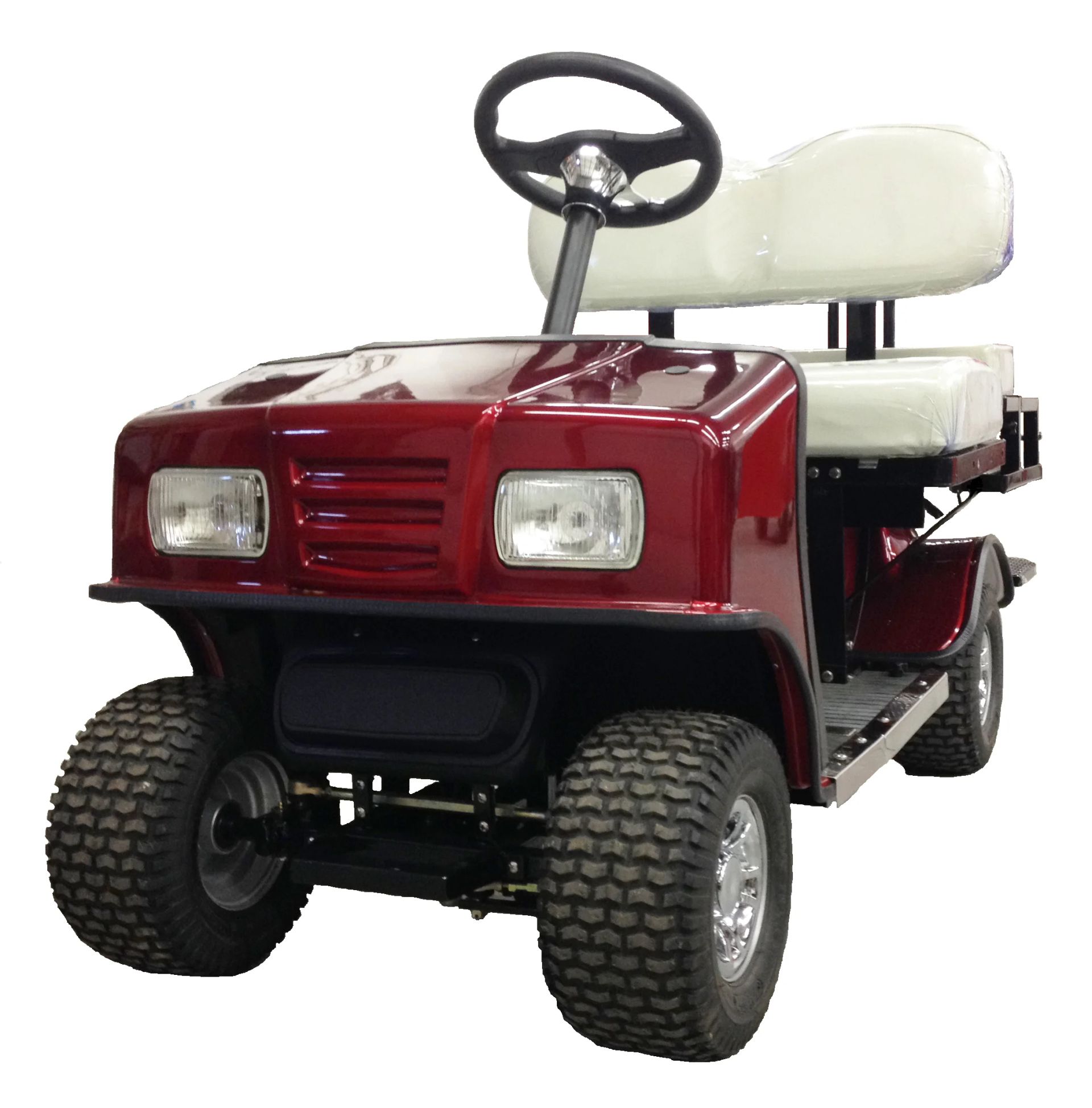 Red golf cart with off-road tires, a white bench seat, and black steering wheel.